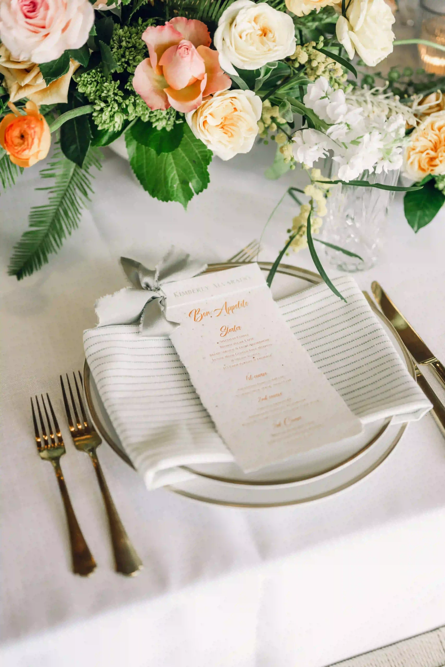 Wedding table setting with silverware and floral decorations